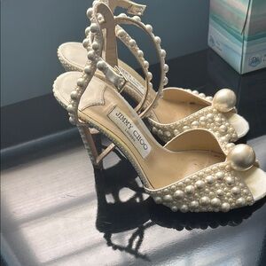 Jimmy Choo Cream Satin Heels with Pearl Embellishments
100 MM